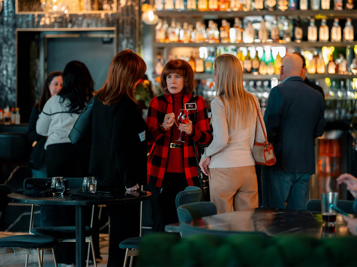 Guests enjoying cocktails and conversation at the Jane Southlake bar and cocktail lounge